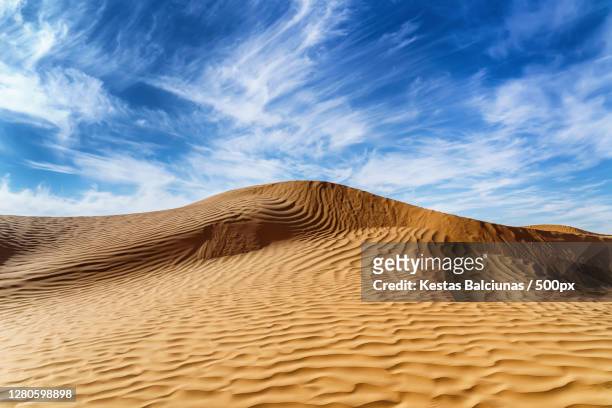 scenic view of desert against sky, ksar ghilane, tunisia - ghilane stock pictures, royalty-free photos & images