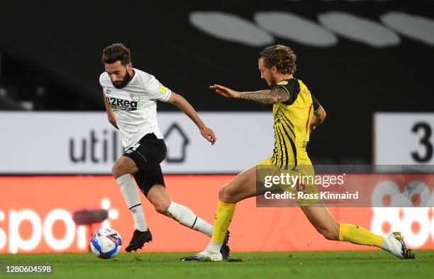 Graeme Shinnie and Ben Wilmot of Watford clash during the Sky Bet Championship match between Derby County and Watford at Pride Park Stadium on...