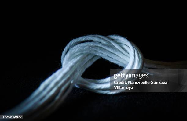 white natural fibre cotton knotted string - rope length stock pictures, royalty-free photos & images