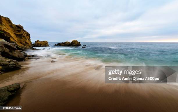 scenic view of beach against sky, laguna beach, california, united states - laguna beach californië stockfoto's en -beelden