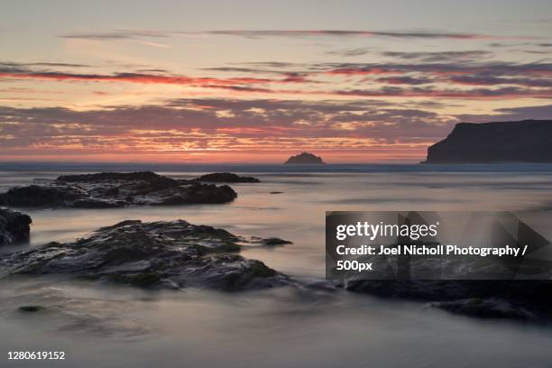 scenic view of sea against sky during sunset,polzeath,england,united kingdom,uk - polzeath bildbanksfoton och bilder