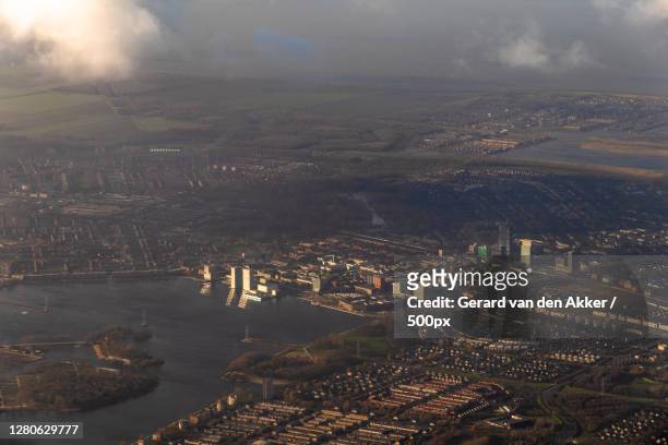 aerial view of cityscape against sky,almere,netherlands - almere stockfoto's en -beelden