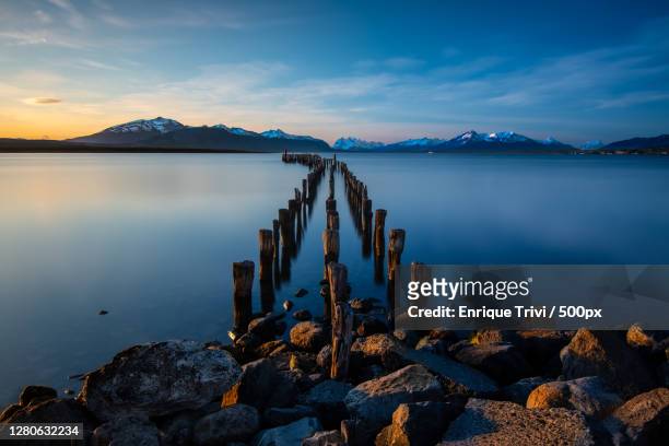 scenic view of lake against sky at sunset,puerto natales,antofagasta,chile - puerto natales stock pictures, royalty-free photos & images