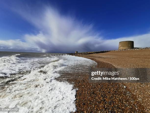scenic view of beach against sky, hythe, united kingdom - hythe stock-fotos und bilder
