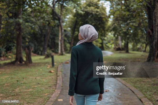 asian women enjoy nature - hijab woman from behind stock pictures, royalty-free photos & images