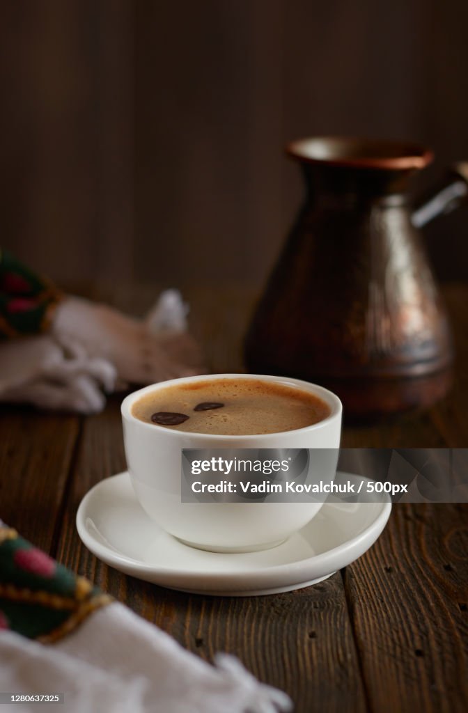 Close-up of coffee cup on table
