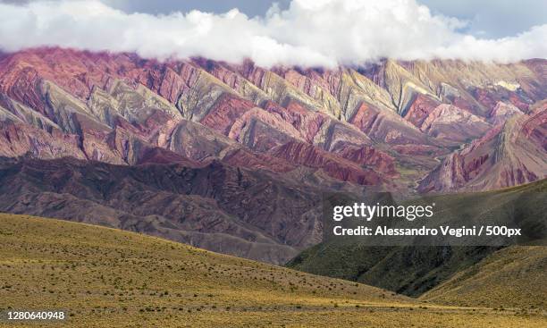 scenic view of landscape against cloudy sky, jujuy, argentina - provinz jujuy stock-fotos und bilder