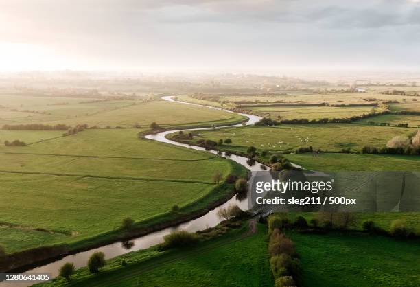high angle view of agricultural field against sky, route des joncs, carentan les marais, france - france stock pictures, royalty-free photos & images