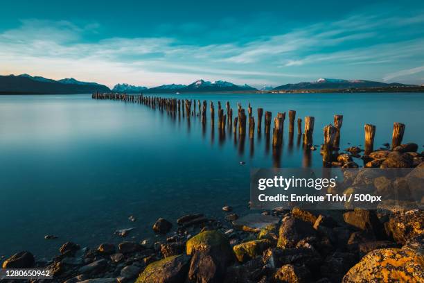 scenic view of sea against sky at sunset,puerto natales,antofagasta,chile - puerto natales stock-fotos und bilder