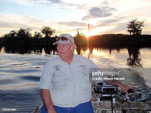 Don Minchew heads his skiff on the Chipola River in Wewahitchka, Florida, in search of flathead catfish. The fish is ugly but tastes great so state...
