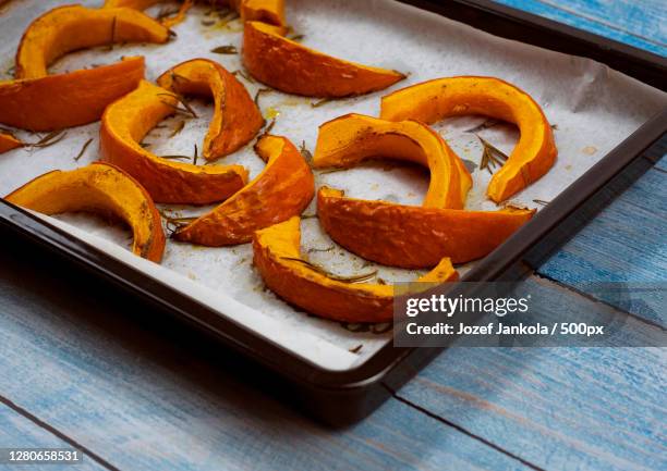 high angle view of pumpkin on table - hokaido pumpkin stock pictures, royalty-free photos & images