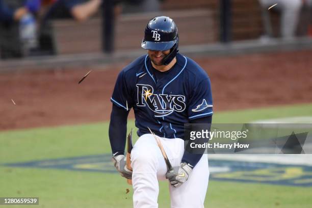 Mike Zunino of the Tampa Bay Rays breaks his bat after striking out against the Houston Astros during the fifth inning in Game Six of the American...