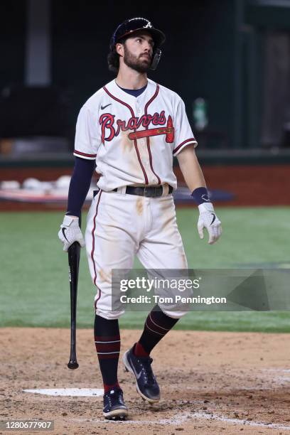 Dansby Swanson of the Atlanta Braves reacts after striking out against the Los Angeles Dodgers during the sixth inning in Game Five of the National...