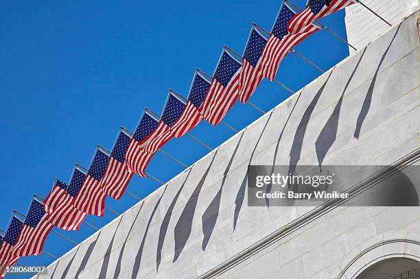 american flags flying atop los angeles city hall, los angeles, california, usa, may 2010 - los angeles city hall imagens e fotografias de stock