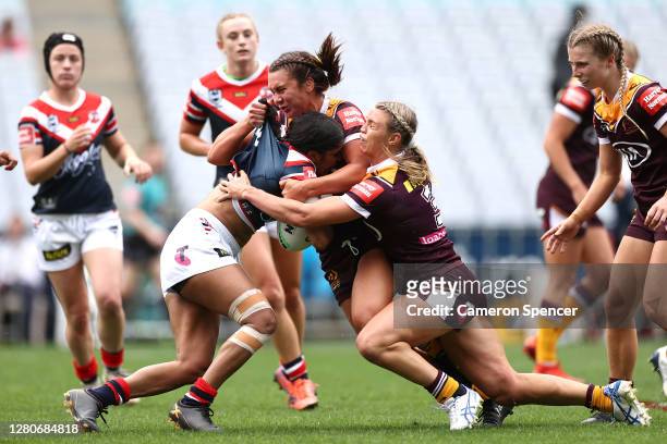 Taleena Simon of the Roosters is tackled during the round three NRLW match between the Sydney Roosters and the Brisbane Broncos at ANZ Stadium on...