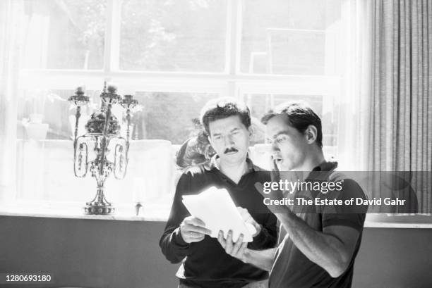 French author and filmmaker Alain Robbe-Grillet and Groce Press editor Richard Seaver confer on a manuscript in September, 1964 in New York City, New...