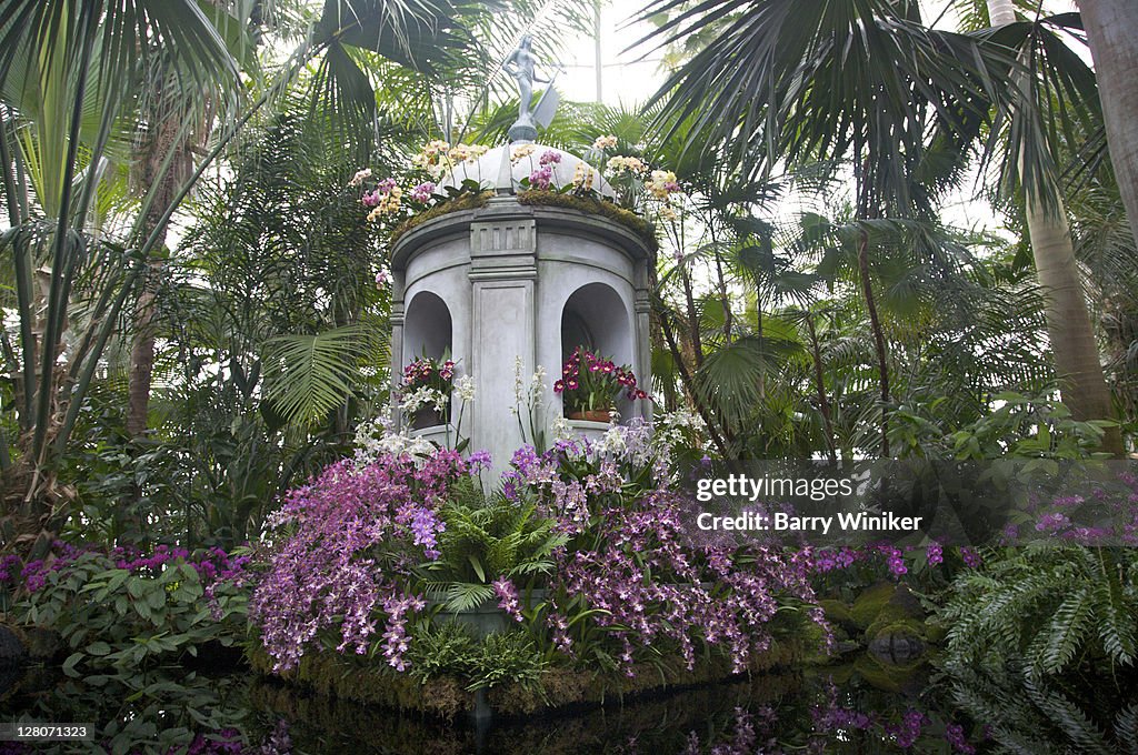 Tower and statue of La Giraldilla from Orchid Show, Cuba in Bloom, at the Enid Haupt Conservatory, The New York Botanical Gardens, The Bronx, New York, USA