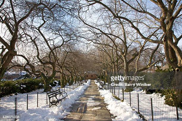 snow on grounds of conservatory garden, central park's six acre formal garden, new york, ny, usa - central park bildbanksfoton och bilder