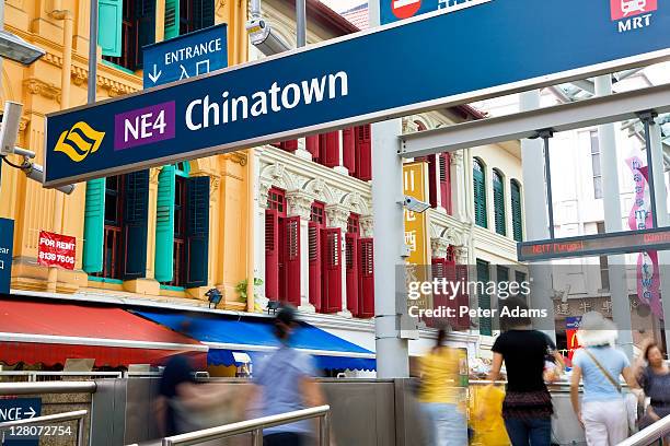 chinatown mrt station entrance in singapore combining new architecture with old style shop houses - singapore mrt stock pictures, royalty-free photos & images