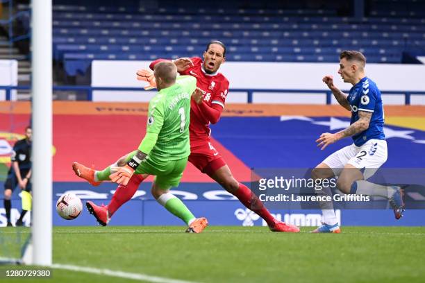 Virgil van Dijk of Liverpool is tackled by Jordan Pickford of Everton which led to Virgil van Dijk being substituted for an injury during the Premier...