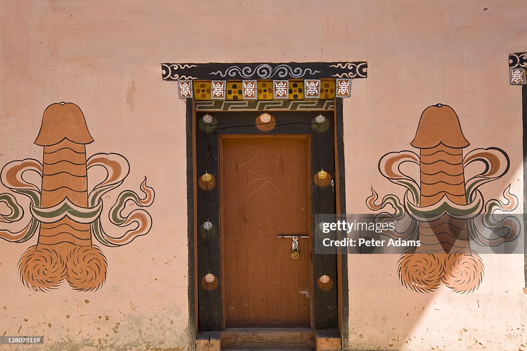 Phallic fertility symbols painted outside house, Pana, Bhutan
