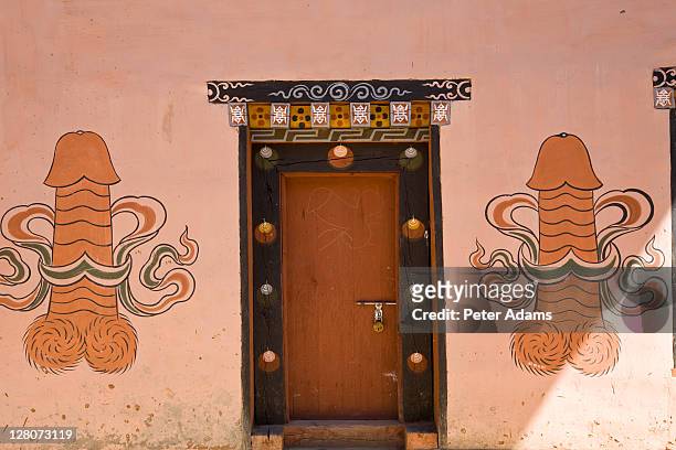 phallic fertility symbols painted outside house, pana, bhutan - penis humour stock pictures, royalty-free photos & images