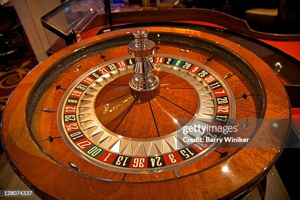 roulette wheel in casino - roulette stock pictures, royalty-free photos & images