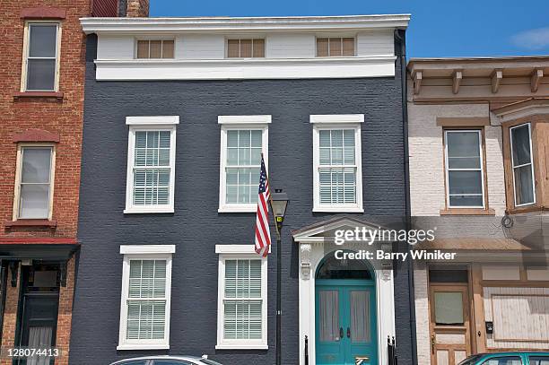 painted brick building with american flag, warren street, hudson, new york - nobod stock pictures, royalty-free photos & images