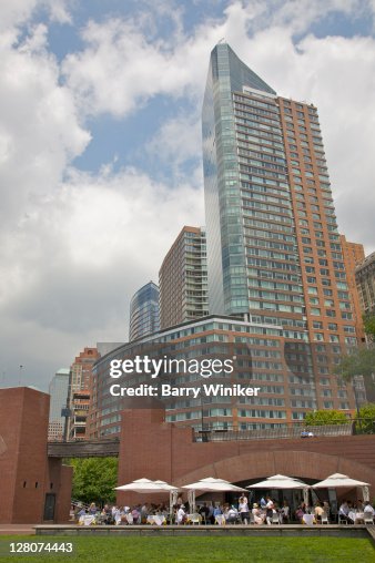 Cafe, overlook and tall residential buildings from Robert F. Wagner Jr. Park, Downtown Manhattan, New York