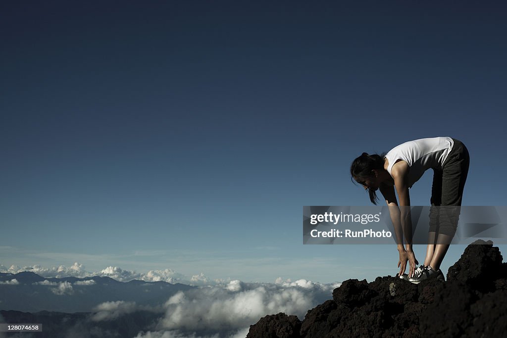 Woman exercising at the mountain