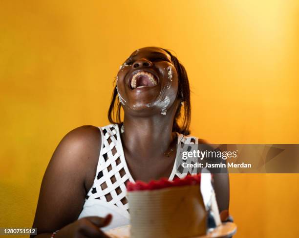 friends having a lot of fun at birthday party - cake face imagens e fotografias de stock