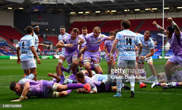 Luke Cowan-Dickie of Exeter Chiefs scores his sides first try as his teammates celebrate during the Heineken Champions Cup Final match between Exeter...