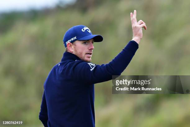 Matt Wallace of England reacts after holing in from a bunker on the 17th hole during Day Three of the Scottish Championship presented by AXA at...
