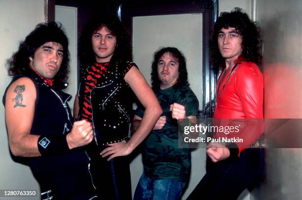 Portrait of the members of American Heavy Metal group Y&T as they pose backstage at the Aragon Ballroom, Chicago, Illinois, October 21, 1983....