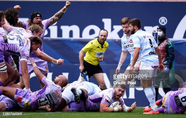 Luke Cowan-Dickie of Exeter Chiefs scores his sides first try as his teammates celebrate during the Heineken Champions Cup Final match between Exeter...