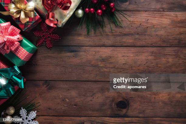 christmas lights and decoration with presents making a frame with copy space. christmas themes. - christmas background copy space stock pictures, royalty-free photos & images