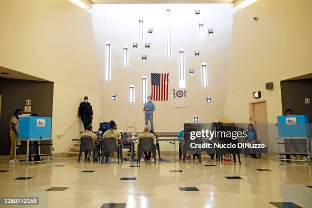 Cook County jail detainees check in prior to casting their votes at a polling place set up for early voting on October 17, 2020 in Chicago, Illinois....