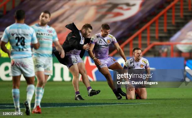 Joe Simmonds of Exeter Chiefs is congratulated by Ollie Devoto and Luke Cowan-Dickie of Exeter Chiefs after victory in the Heineken Champions Cup...