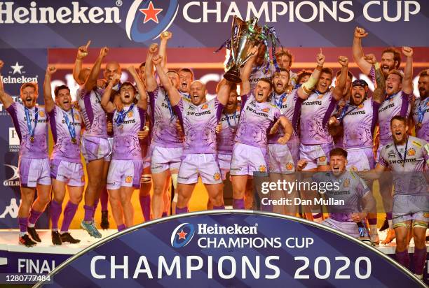 Exeter Chiefs captains Jack Yeandle and Joe Simmonds lift the Heineken Champions Cup Trophy with teammates after victory in the Heineken Champions...