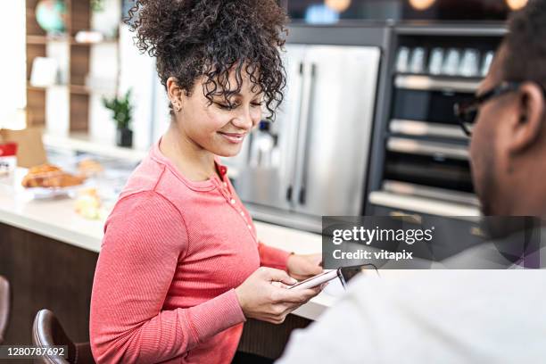 looking at her instagram feed - file sharing stock pictures, royalty-free photos & images