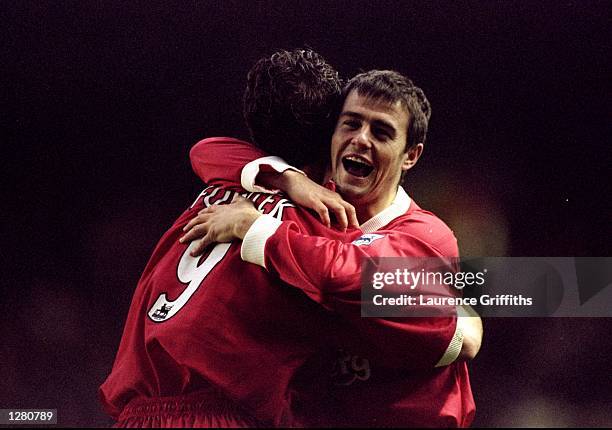 David Thompson and Robbie Fowler of Liverpool celebrate during the FA Carling Premiership match against Southampton at Anfield in Liverpool, England....