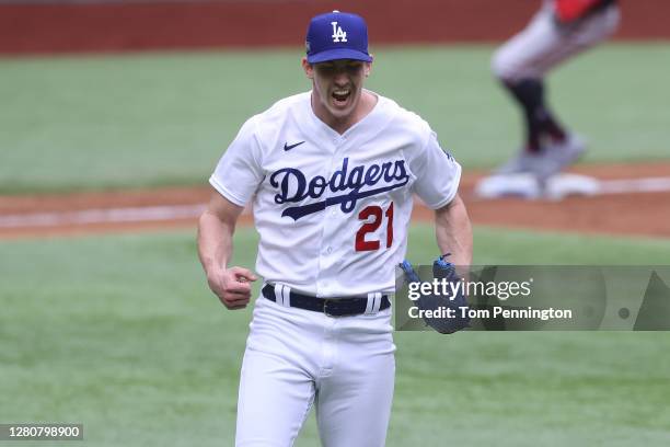 Walker Buehler of the Los Angeles Dodgers celebrates after retiring the side with the bases loaded against the Atlanta Braves during the second...