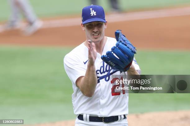 Walker Buehler of the Los Angeles Dodgers celebrates after retiring the side against the Atlanta Braves during the fourth inning in Game Six of the...