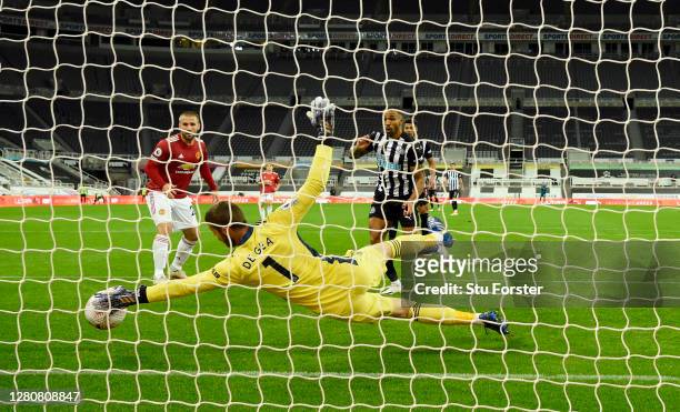 Manchester United goalkeeper David de Gea makes a superb save from a shot from Callum Wilson during the Premier League match between Newcastle United...