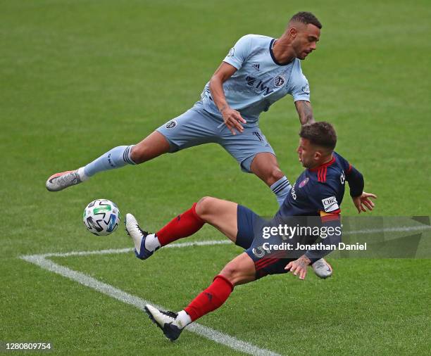 Khiry Shelton of Sporting Kansas City collides with Francisco Calvo of Chicago Fire at Soldier Field on October 17, 2020 in Chicago, Illinois....