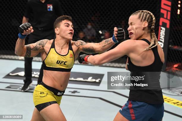 Jessica Andrade of Brazil punches Katlyn Chookagian in their women's flyweight bout during the UFC Fight Night event inside Flash Forum on UFC Fight...