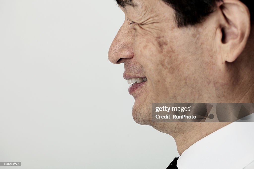 Old age businessman'ssmile,profile