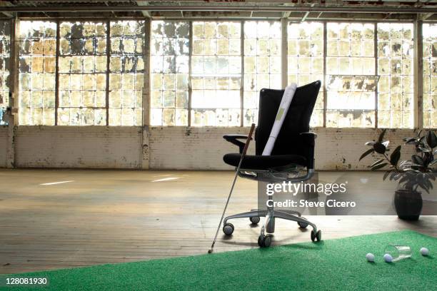 empty warehouse with putting green - man cave stock pictures, royalty-free photos & images