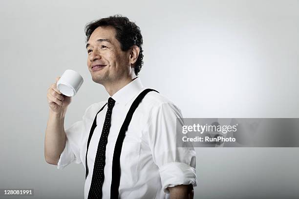 old age businessman drinking a beverage - trouser braces stock pictures, royalty-free photos & images