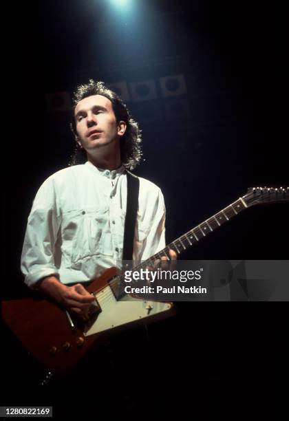 English Rock musician the Edge , of the group U2, performs onstage at the UIC Pavilion, Chicago, Illinois, March 20, 1985.